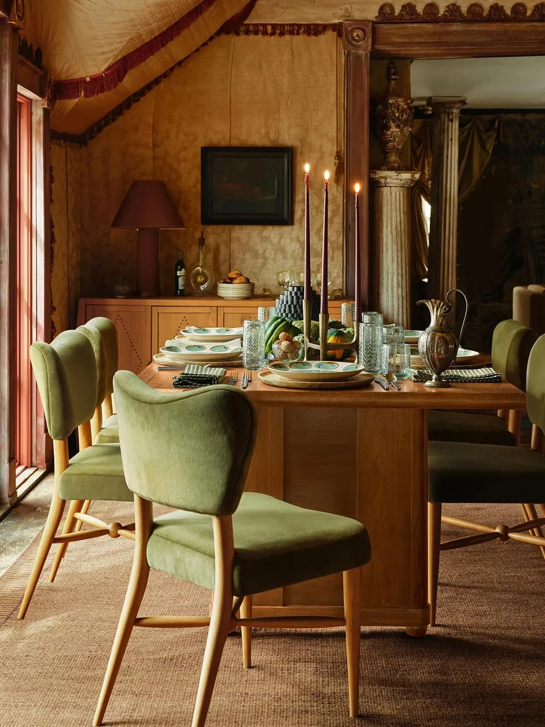 Framed Dining Table,Curved Back Dining Chair,Perforated Buffet,Ceramic Dinnerware Collection, andEtched Glassware Collection. | Courtesy of West Elm