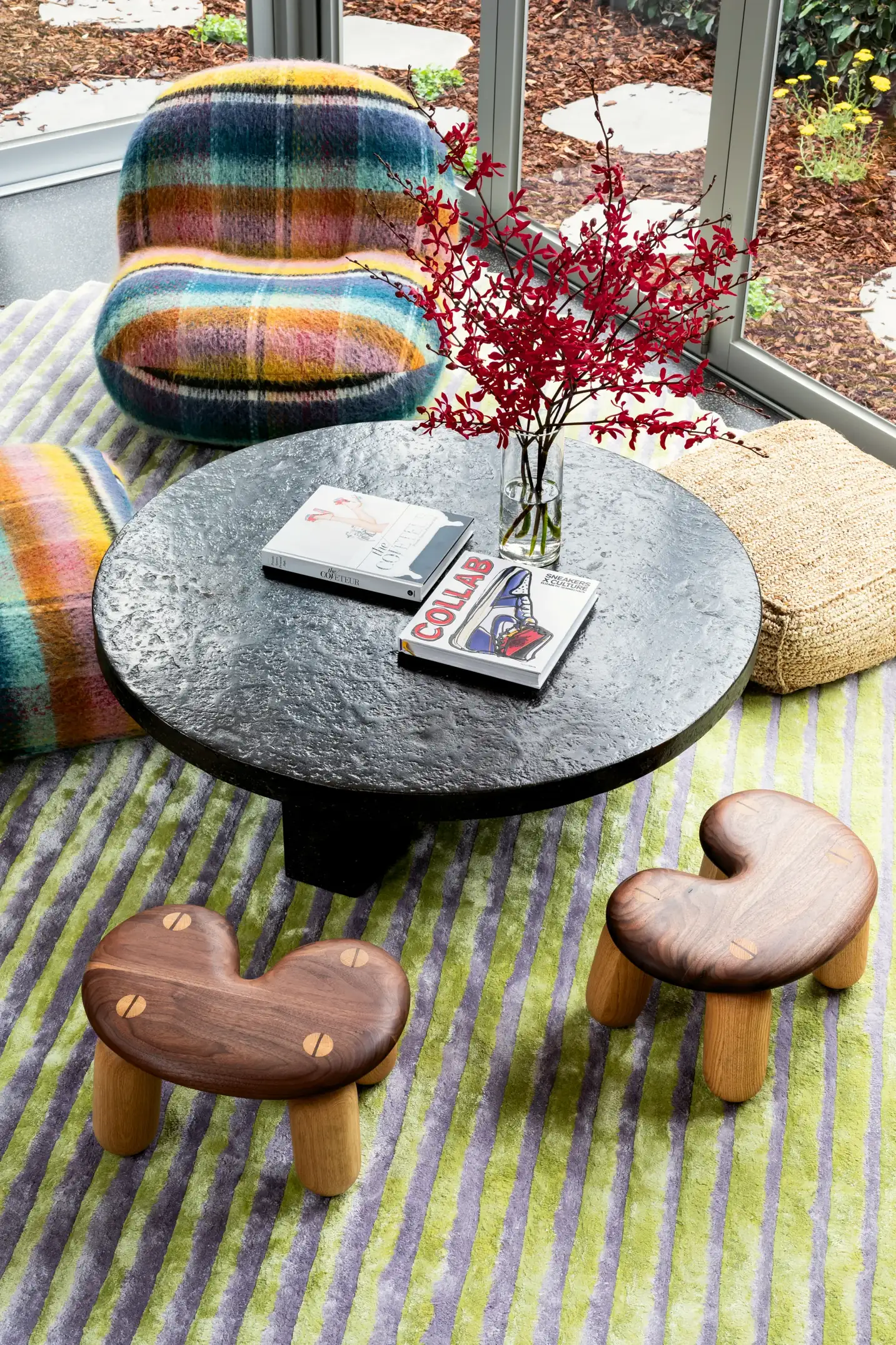 Designers like to talk a lot about developing layers in a room, it's how we add life to a space. Texture is the most important element to get right, and this room nails it. Stone, wood, seagrass, stri