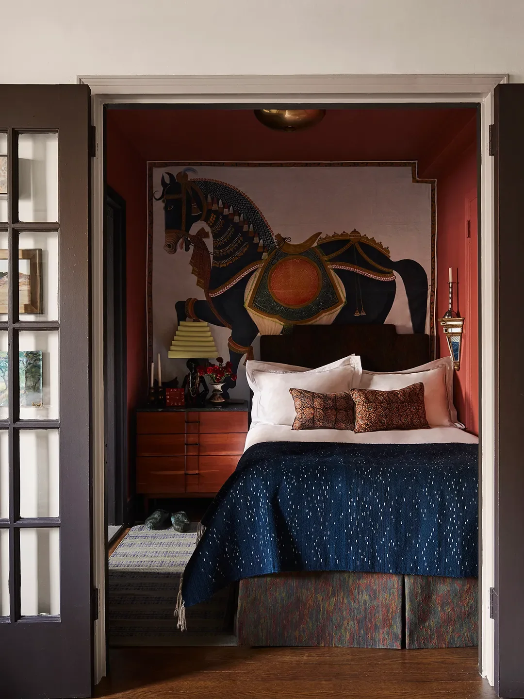 The horse panel was a gift from Tom; he had a couple of extras as he was cleaning house. I picked a wall color from it—I just put up all the reds from Farrow & Ball and Picture Gallery Red was the one