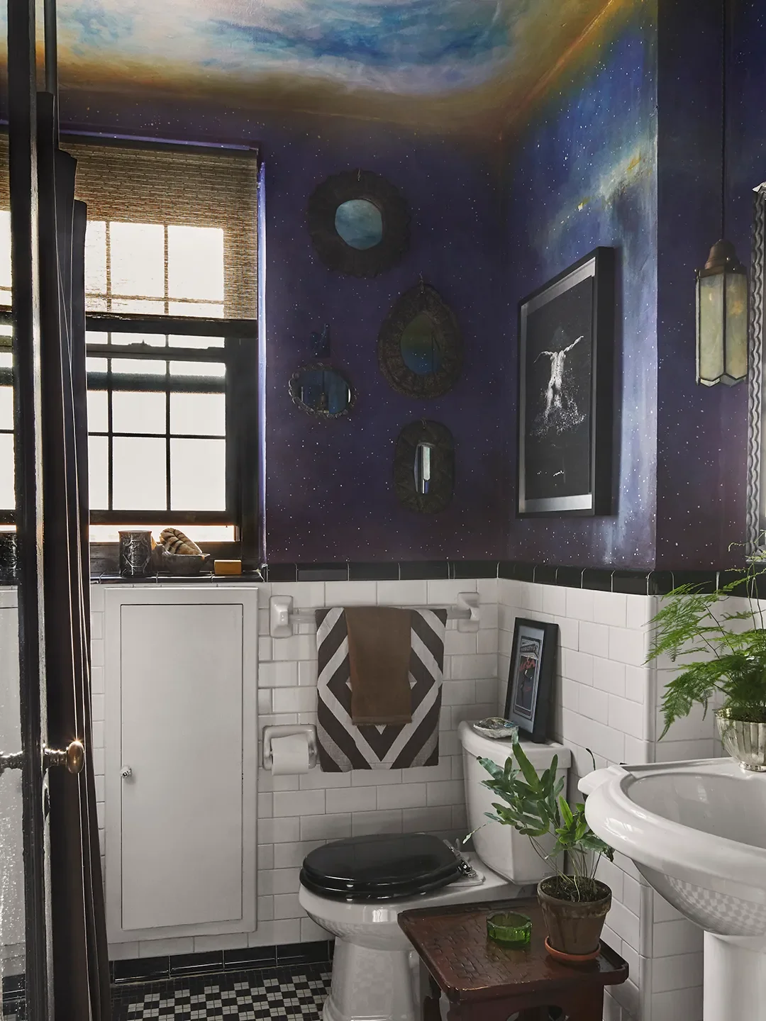 The bathroom mural, done by a decorative painter, was inspired byNocturne in Black and Gold, The Falling Rocketby James McNeil Whistler. As a child, I loved the night sky in a bedroom; I wanted someth