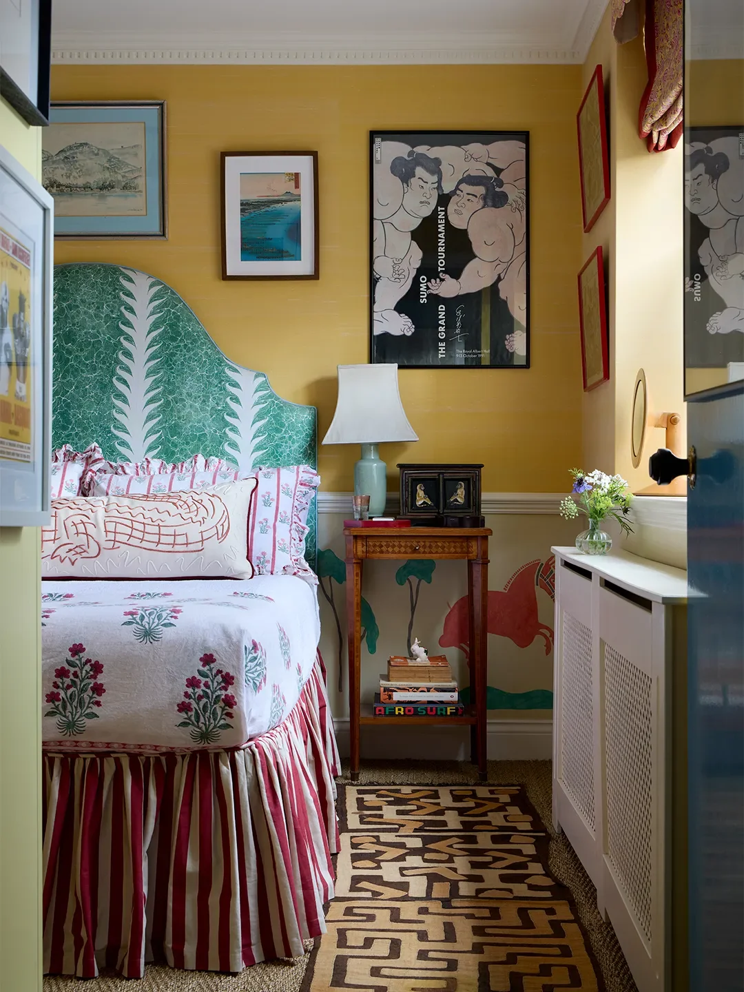 In India Holmes’s bedroom, red, yellow, and green are thoughtfully combined across a range of patterns and motifs. “I have always loved red and yellow together,” she says.