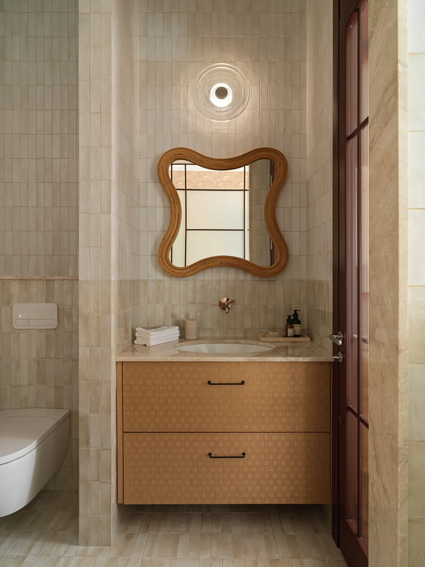 Mirror,India Madhavi; Wall sconce,Tom Dixon; Faucet, Axor.