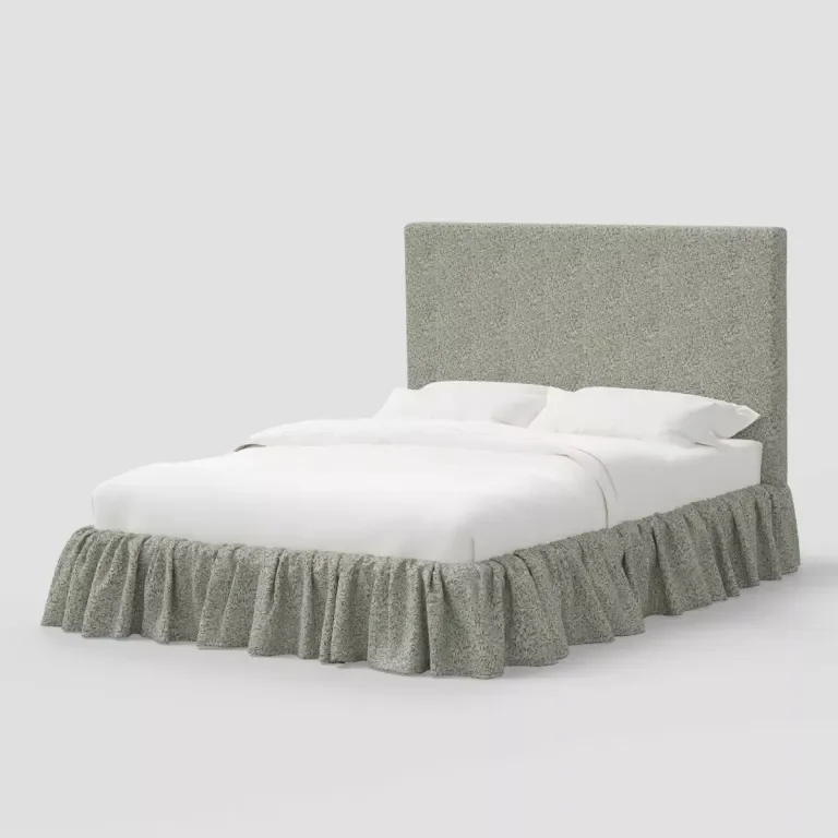 floral upholstered bed frame with ruffle skirting