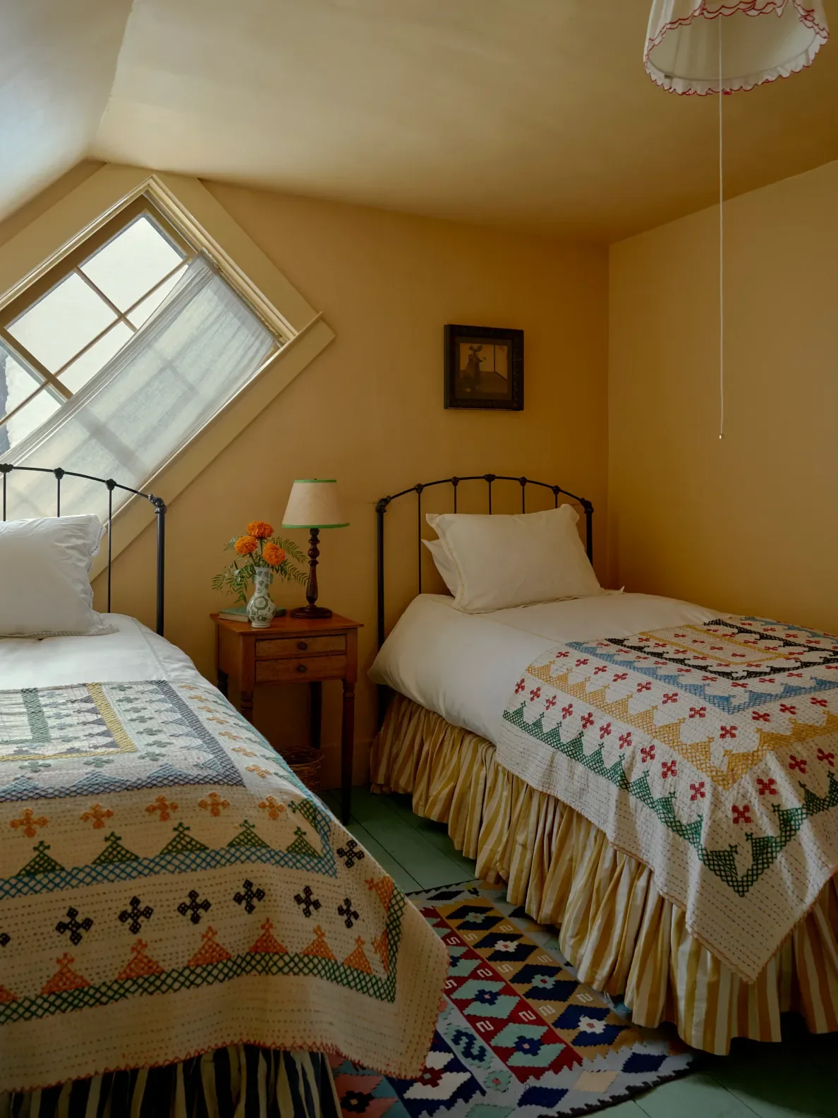 Paint,Sudbury Yellowby Farrow & Ball; Bedspreads,Sourced by Holly; Bed frames,Charles P. Rogers.