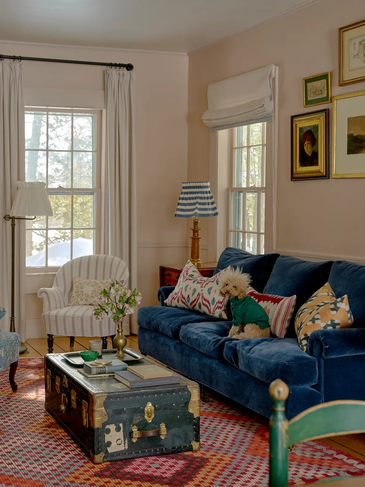 Johnston’s dog Rugger right at home. Paint,Setting Plasterby Farrow & Ball; table lamp,Alice Palmer; window treatments,RomoandMark Alexander.